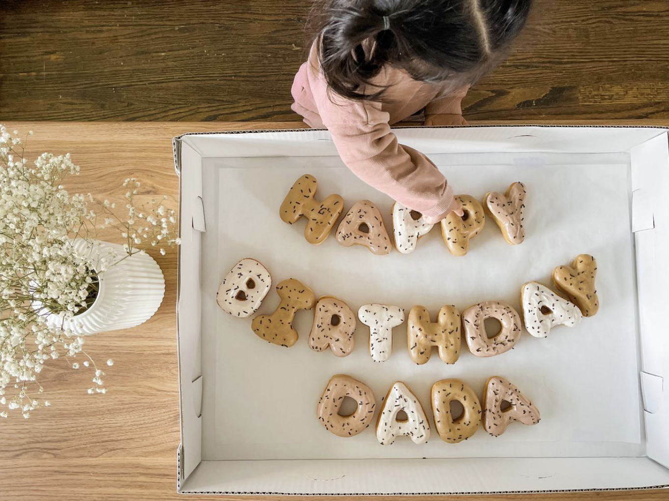 The daughter of a Letterbox Doughnuts client with a birthday arrangement 