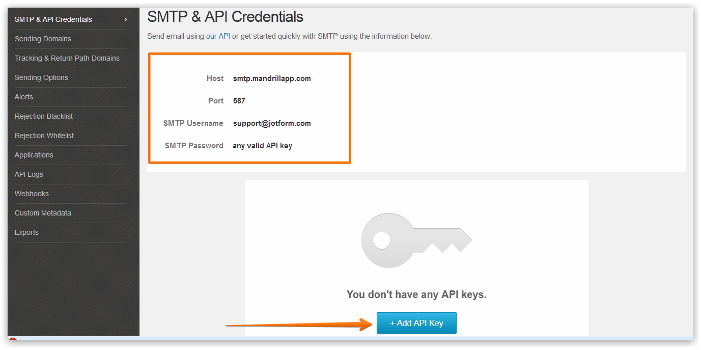 Capture d'écran des identifiants SMTP saisis dans le tableau de bord Mandrill avec une flèche pointant vers le bouton Créer une clé API