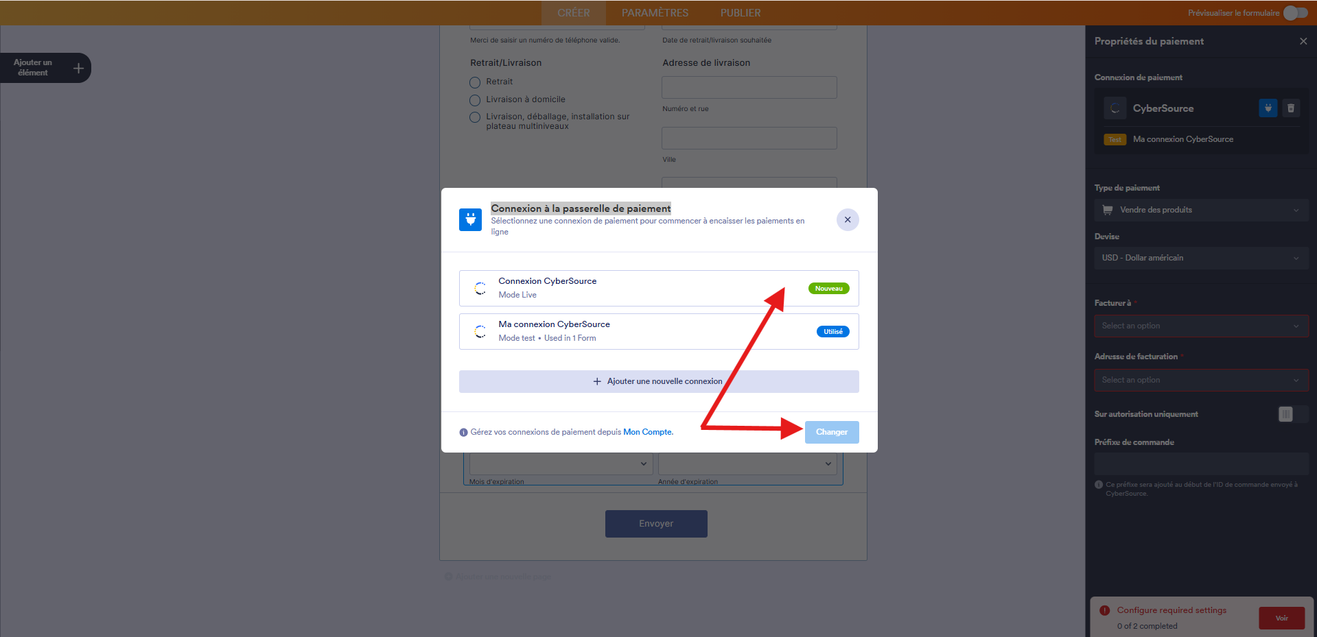 Capture d'écran de la fenêtre modale Connexion à la passerelle de paiement dans le Générateur de formulaires Jotform avec une flèche vers la nouvelle connexion enregistrée et une autre vers le bouton Changer