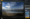 Skylum Luminar Neo interface showing an image of a snowy mountain range with the sky replaced by AI