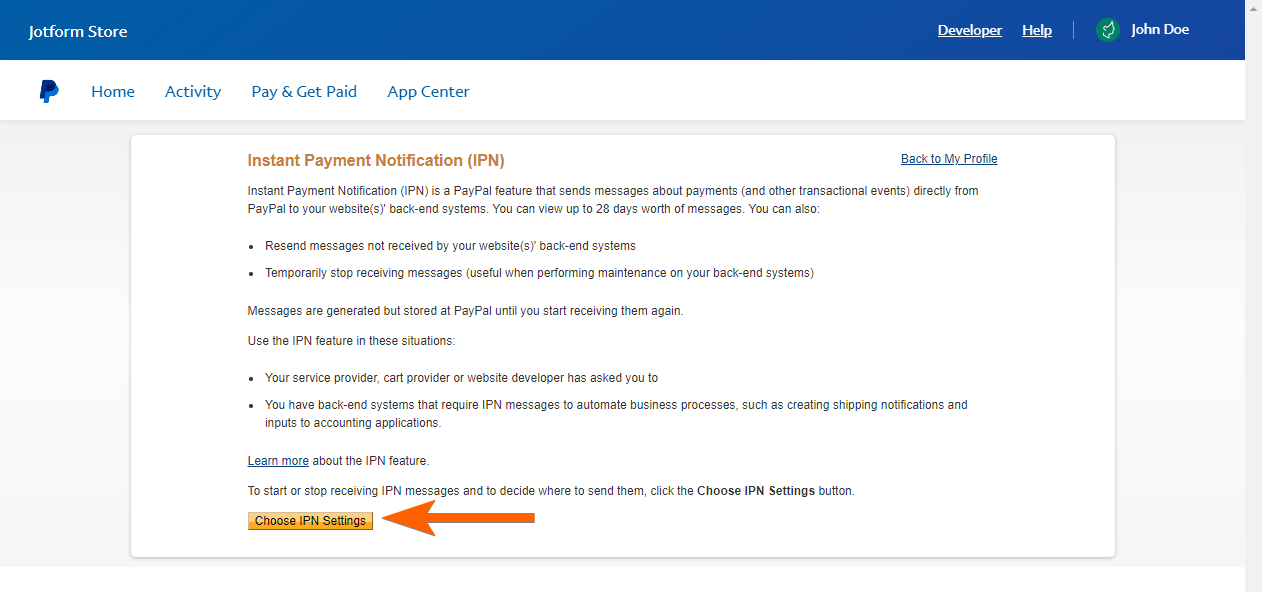 Capture d'écran de la page Notifications instantanée de paiement (IPN) avec une flèche pointant vers le bouton Choisir les paramètres IPN