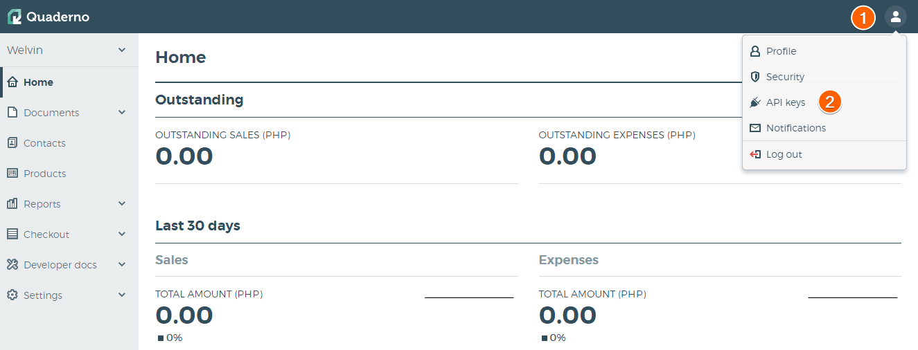 Capture d'écran de l'interface Quaderno avec le chiffre 1 à côté de l'icone de Profil du compte en haut à droite et un chiffre 2 dans le menu, à côté de API keys
