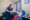 Woman helping an elder woman in the case center